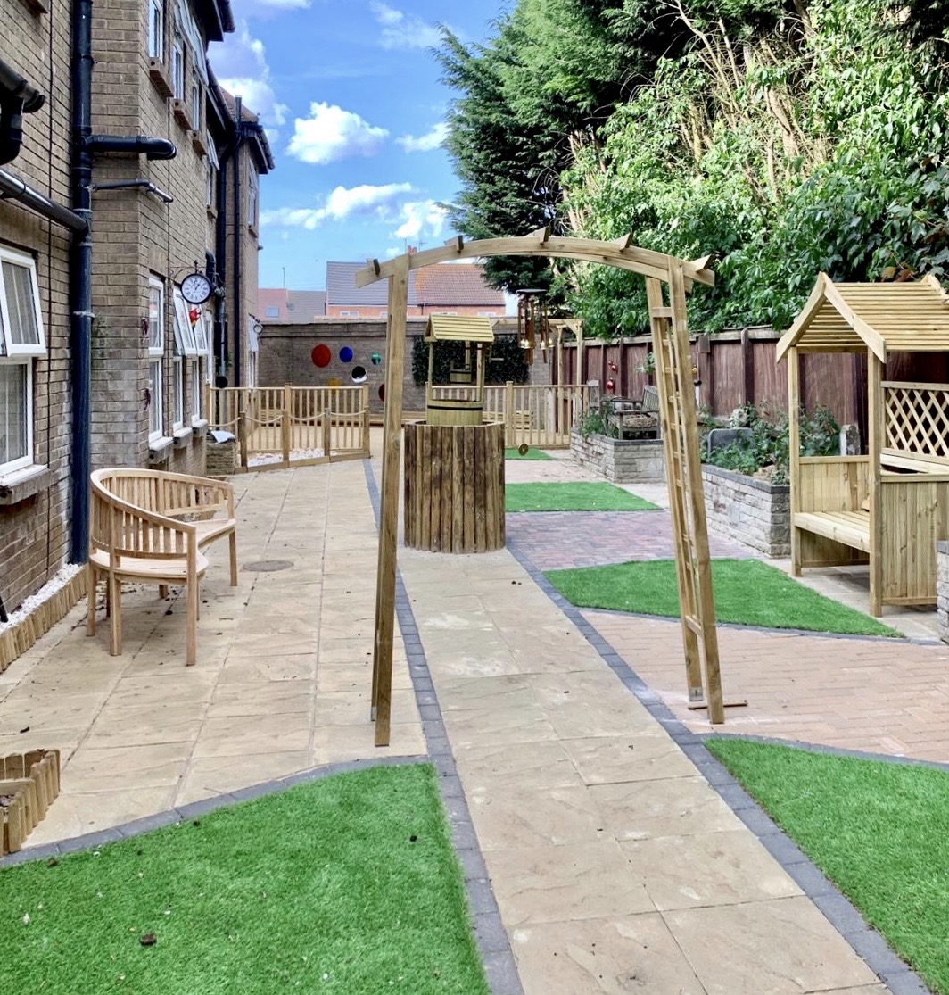 Garden with wooden pergola seating